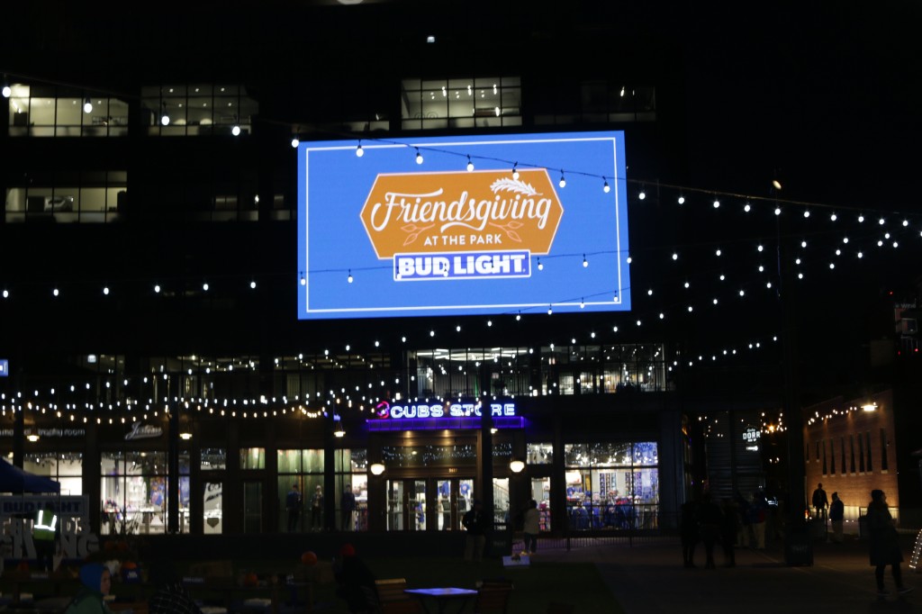 Food trucks including The Fat Shallot and Lobster on Board under bistro lights outside Wrigley Field