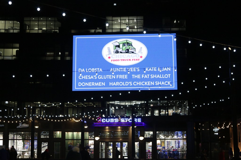 Crowd at The Fat Shallot truck reading the chalkboard sandwich menu during the Friendsgiving event