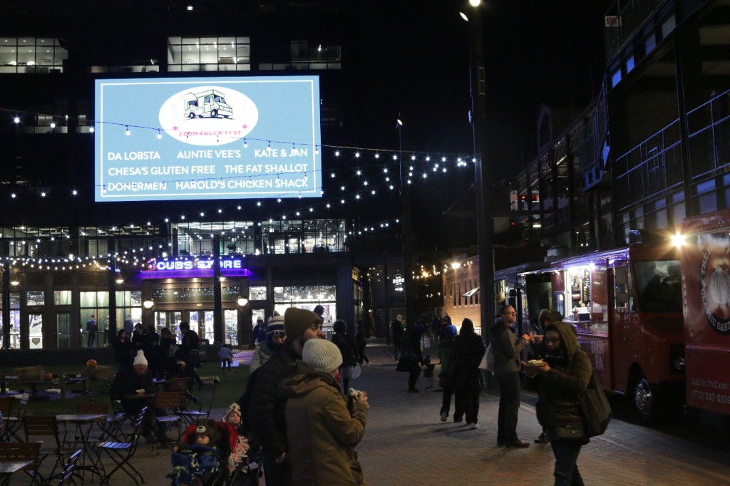 Keyboardist on a Yamaha keyboard with a framed signed photo on stage under pink lighting